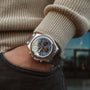 "Koh Mak" watch in Walnut and Marble design with a sleek, modern style on a wrist.