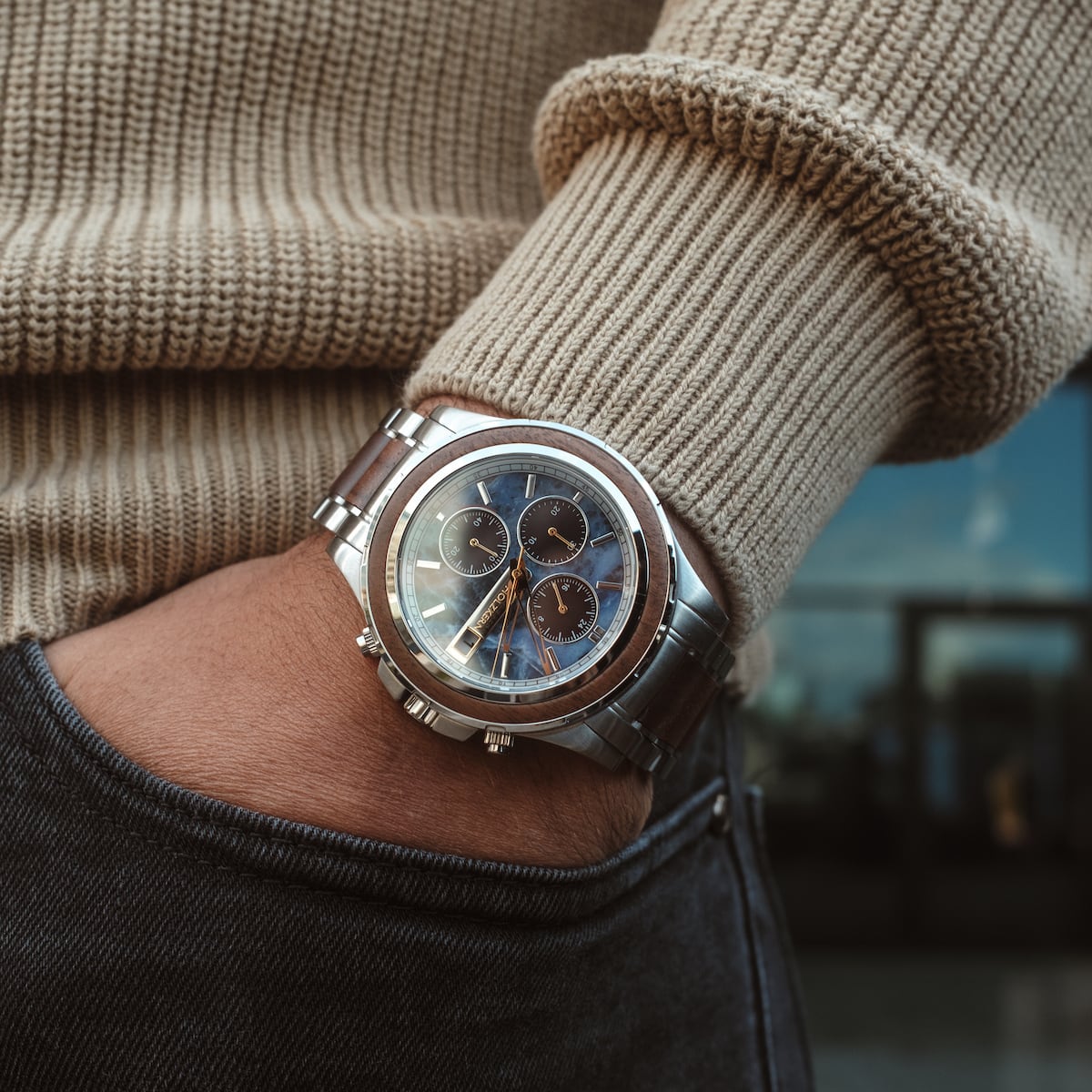 "Koh Mak" watch in Walnut and Marble design with a sleek, modern style on a wrist.