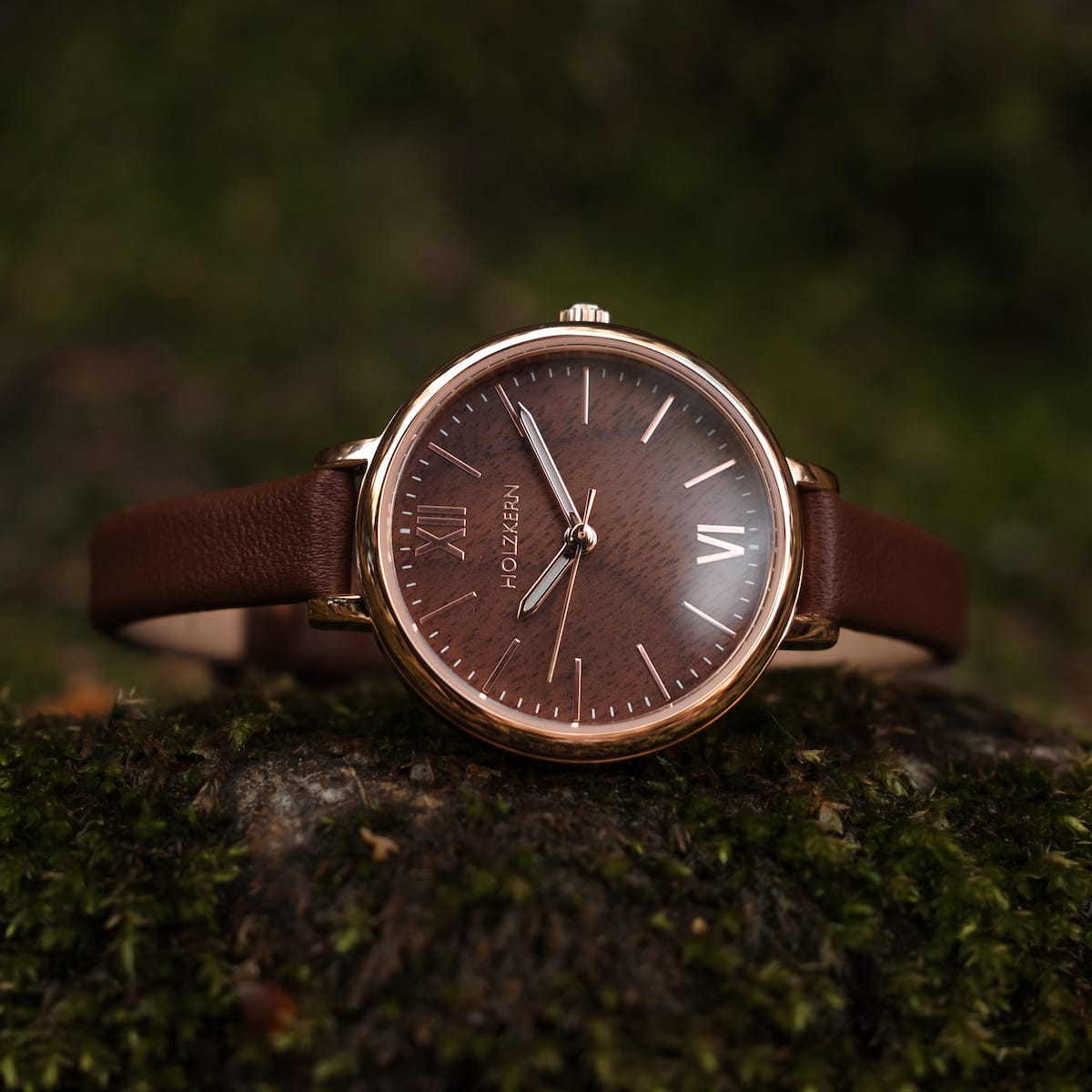 "Shirin" watch in walnut and rose gold with a sleek, elegant design.