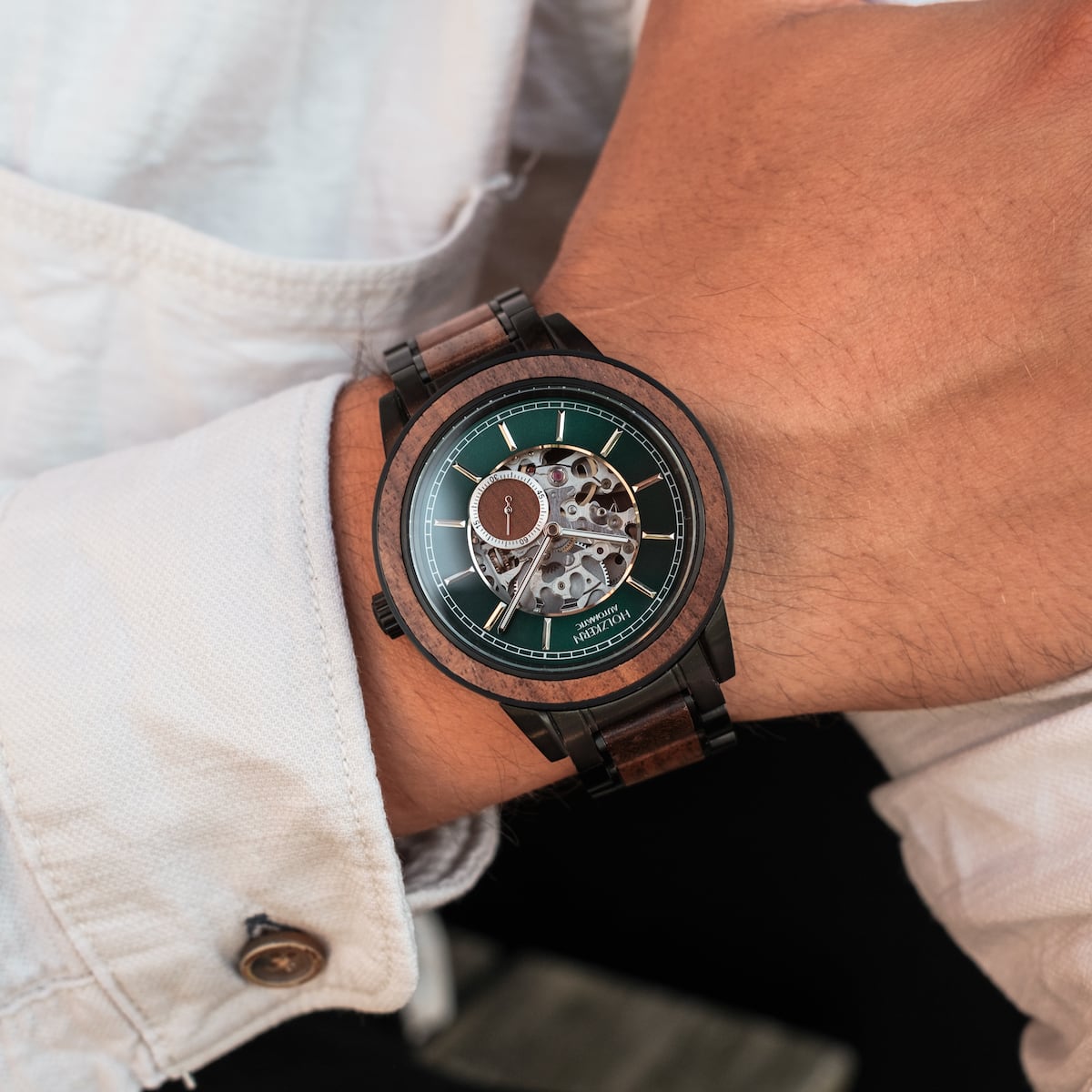 "Sigiriya" watch featuring a walnut design and elegant mechanical style on a wrist.