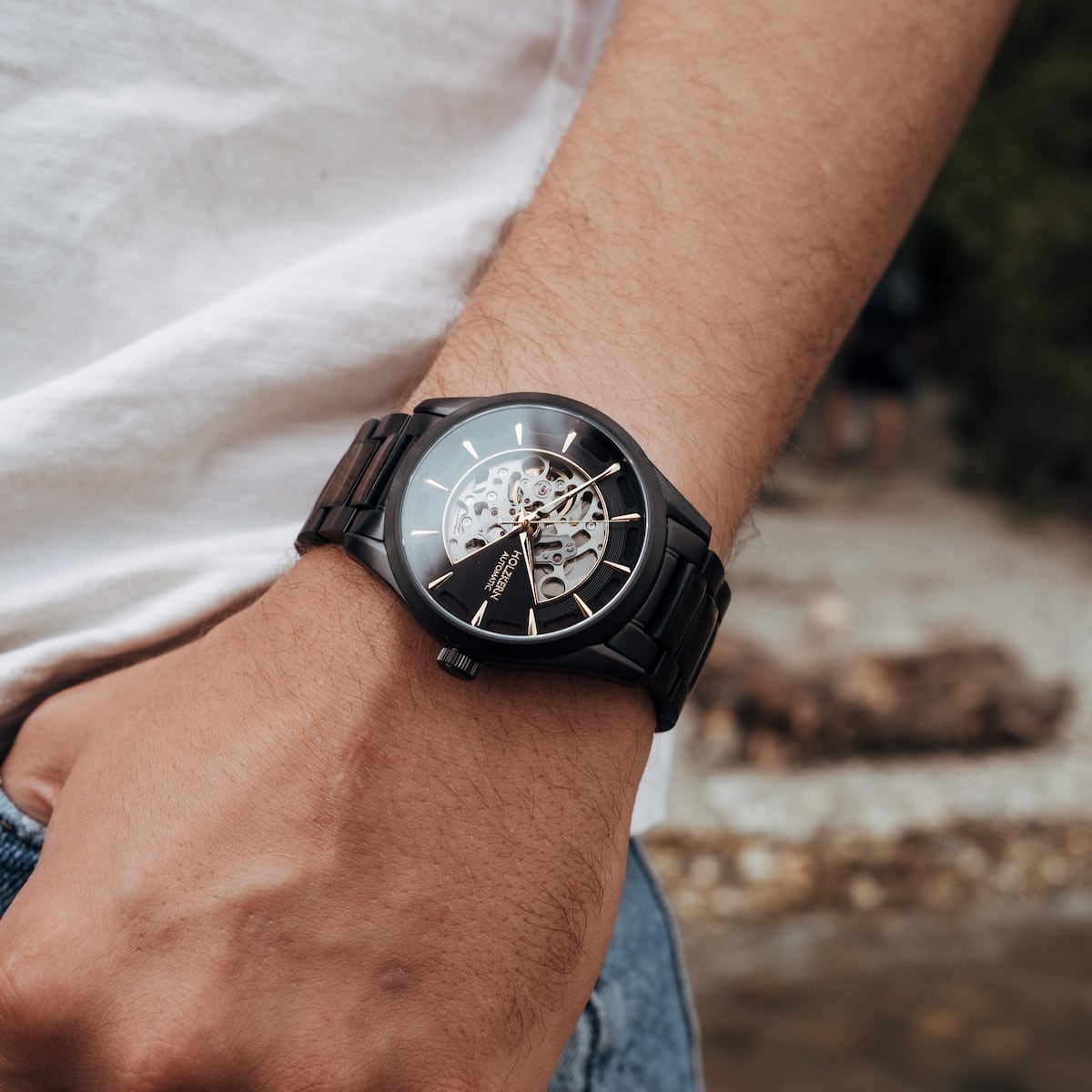 "Woodleigh" watch in Maple/Black with a sleek, modern design and visible mechanism.