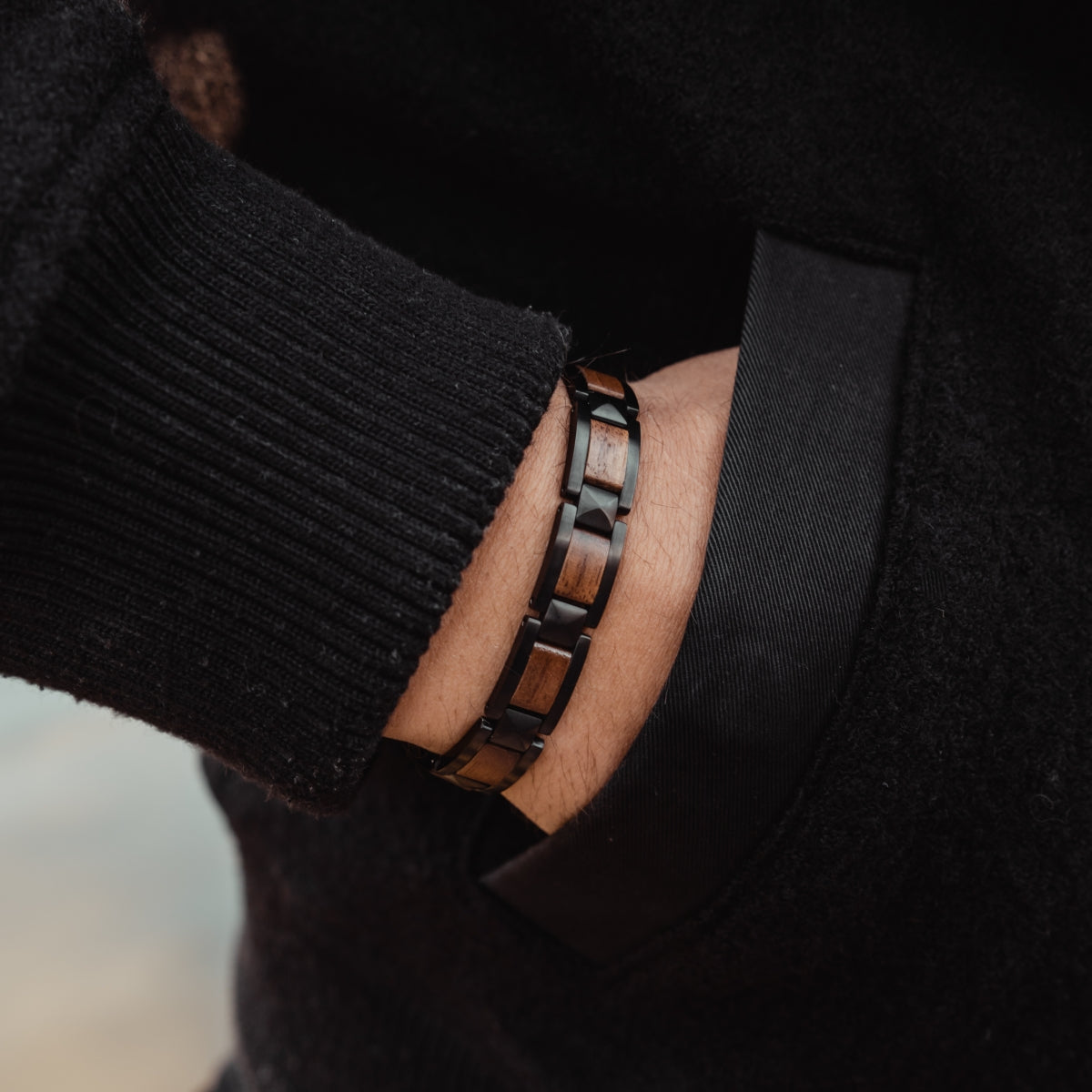 "Rhapsody" bracelet features a sleek walnut and black design, ideal for a stylish, modern look.