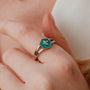 "Spectral Ring": a silver ring featuring a hexagonal nacre inlay with a star design.