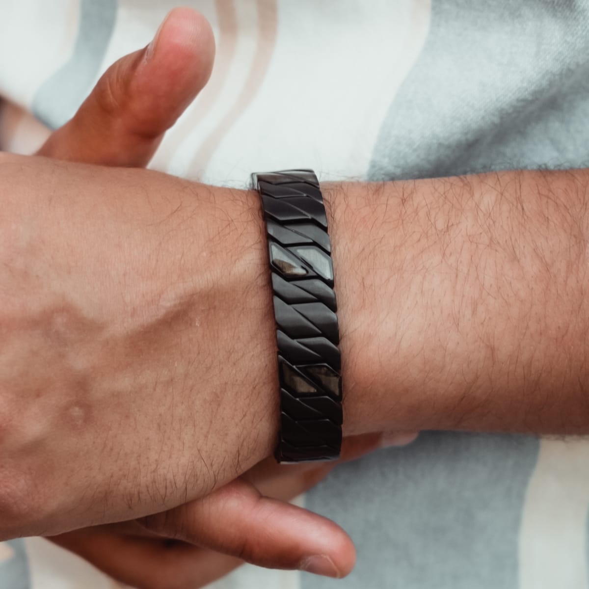 "Baritone" bracelet featuring a sleek, maple-black design.