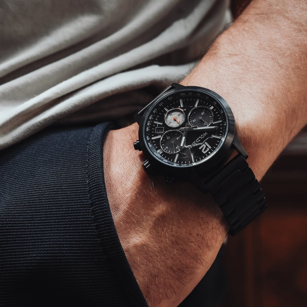 "Rahotu" watch featuring a marble and black design with a sleek, modern style on a person's wrist.