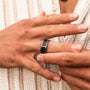 "Countless Ring" ring featuring a modern blend of maple and dark gray with a sleek finish.