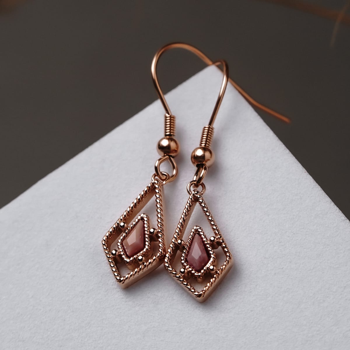 Daydreamer Earrings: Elegant rose quartz and rose gold earrings with a geometric design.