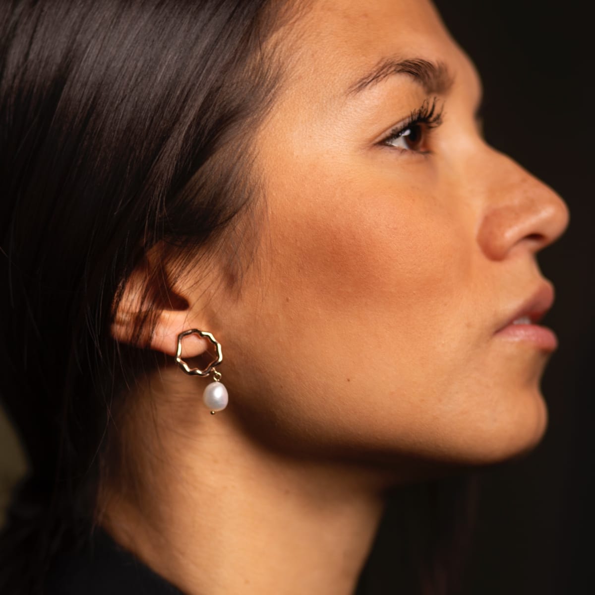 "Oceanfoam Earrings" earrings with a pearl drop and gold accents, featuring a delicate, elegant style.
