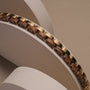 "Duet", a bracelet combining zebrawood and gold for a luxurious and stylish look.