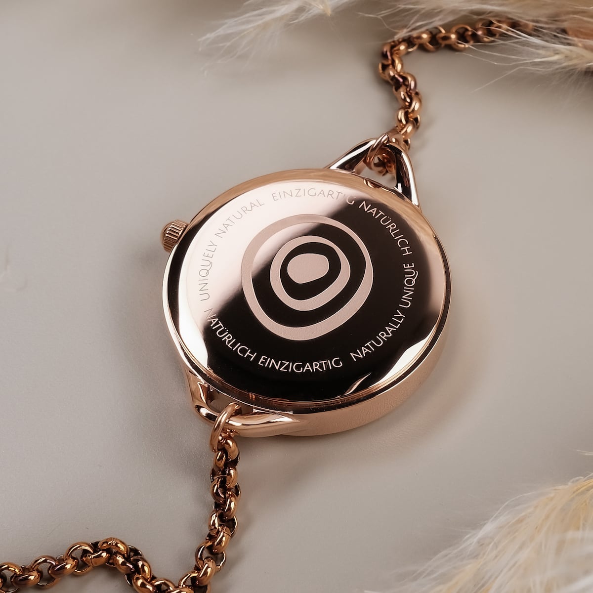 "Blissed" watch in Walnut and Rose gold with a sleek, polished design.