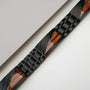 "Looper" bracelet featuring zebrawood and black elements in a sleek, modern design.