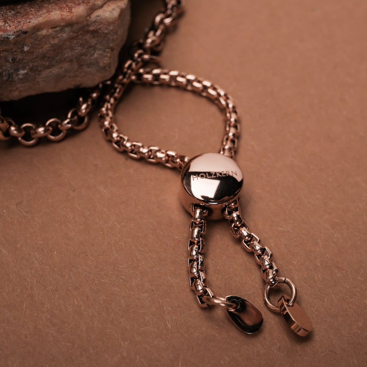 "Leave", a stylish chain accessory with walnut accents and a polished finish.