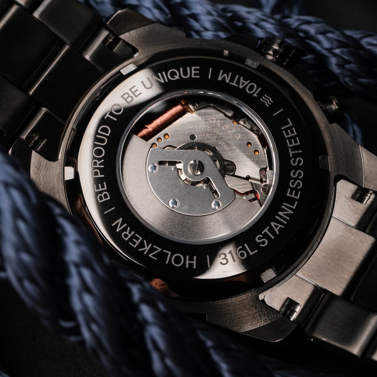 "Frostheave" watch featuring a refined marble and zebrawood design with a unique stainless steel casing.