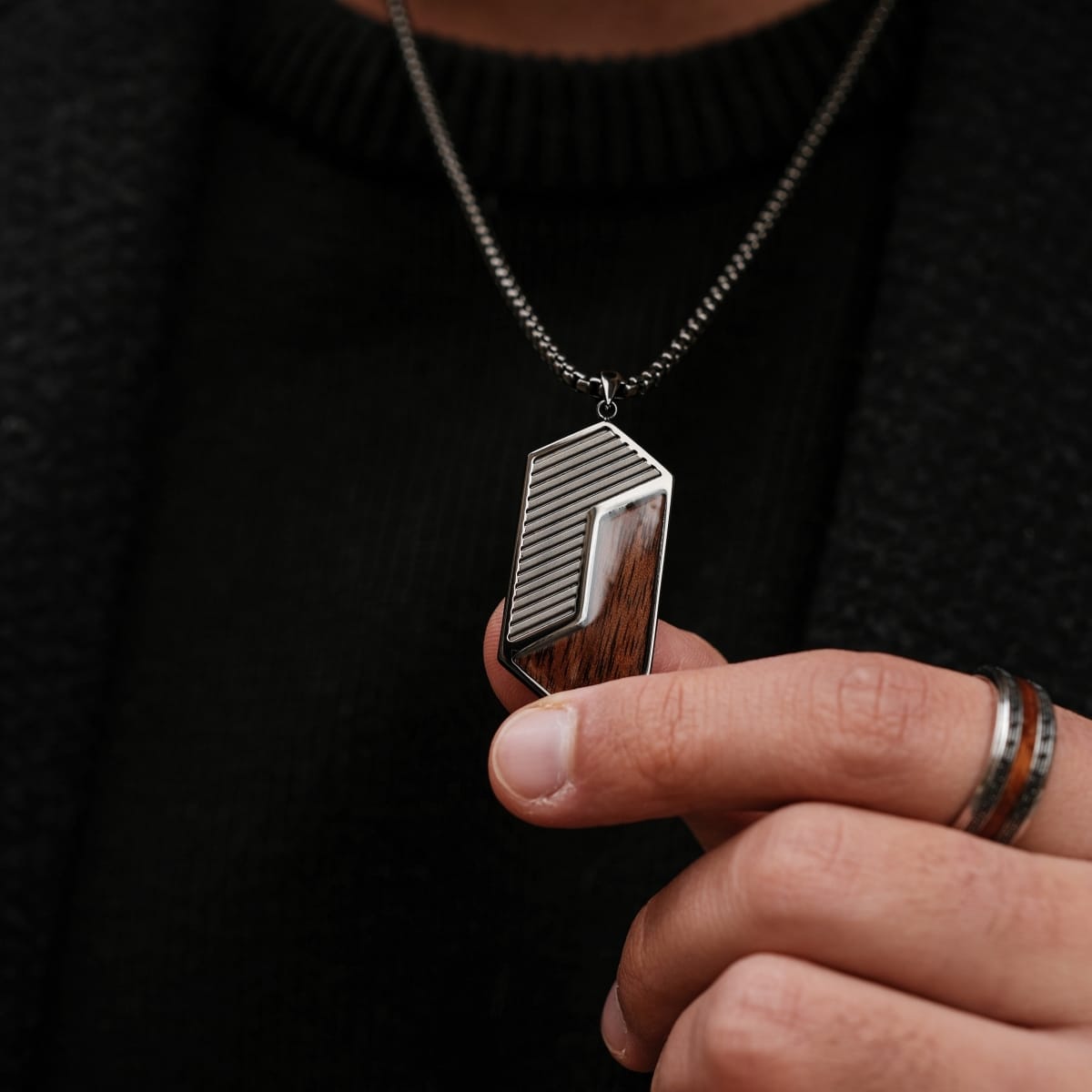 "Zigzag Necklace", a geometric walnut and dark gray necklace, hero by hand for a sleek, modern look.