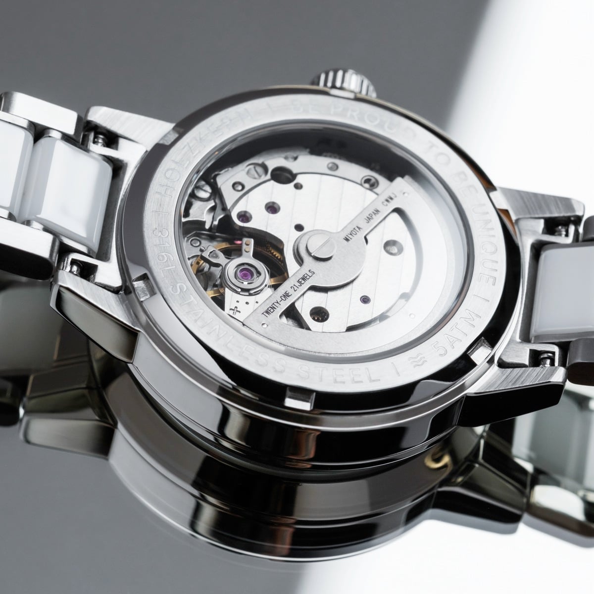 "Cristals" watch featuring a stainless steel case and ceramic accents with a sleek, modern aesthetic.
