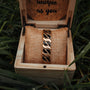 "Baritone" bracelet in gold and black, displayed in a stylish wooden box with natural accents.