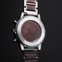 "Oscar", a stylish watch featuring walnut accents and a sleek design.