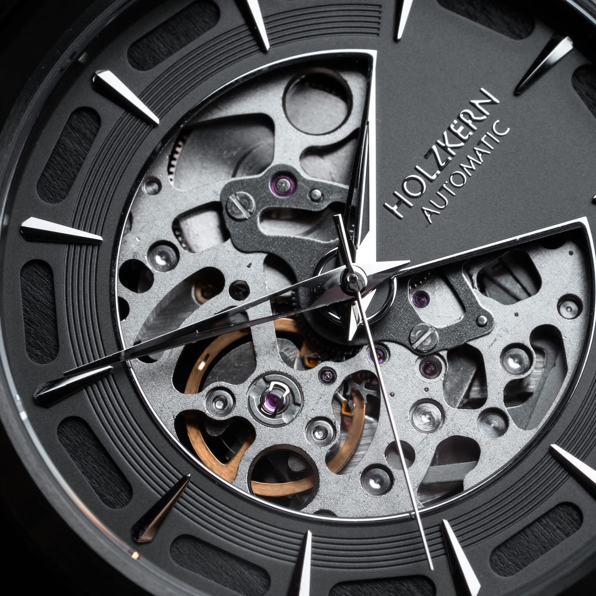 "Morasko" watch featuring a skeletal design with dark gray and maple elements.