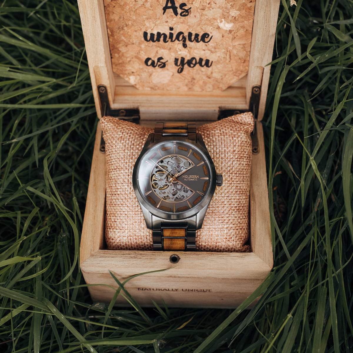 "Tenoumer" watch in koa and dark gray, featuring a unique skeleton design in a wooden box.