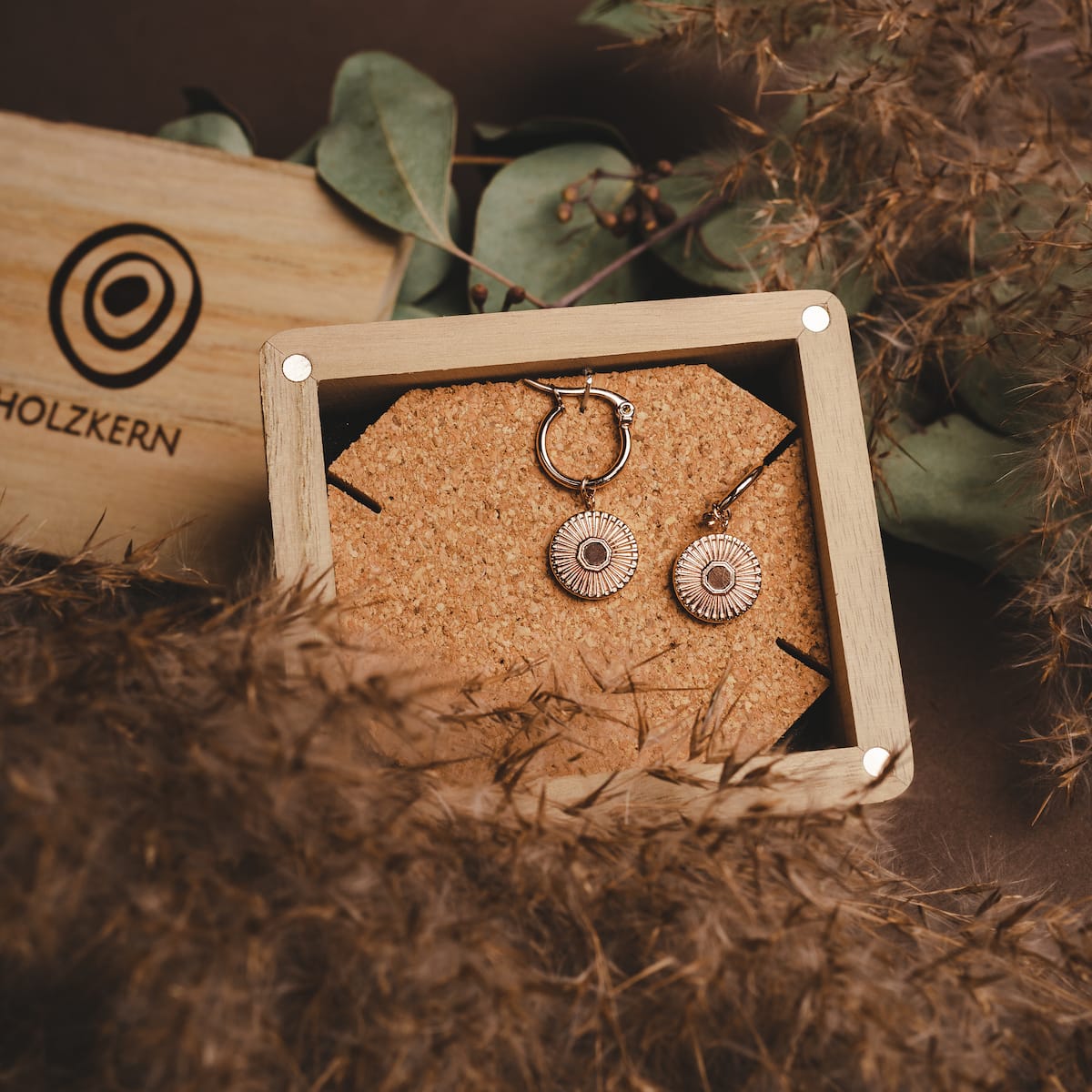 Stencil earrings: Stylish earrings featuring walnut and rose gold accents.
