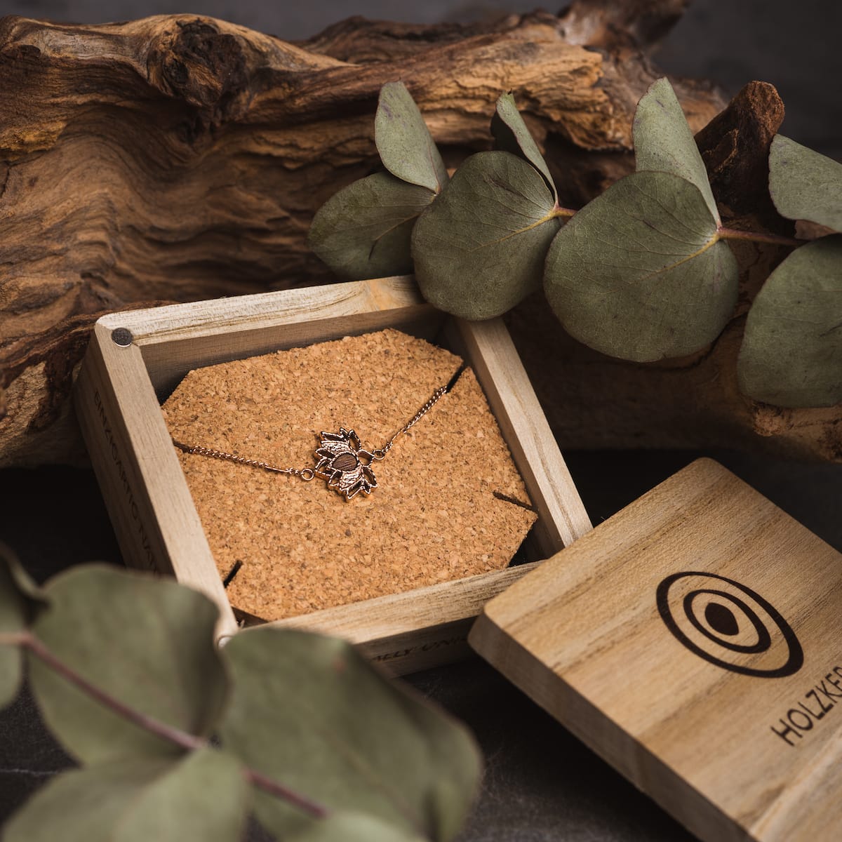 "Balance Bracelet", a stylish bracelet featuring walnut and rose gold, elegantly presented in a rustic wooden box.