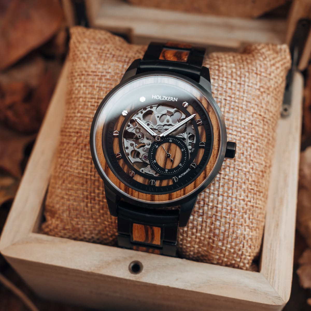 Starnum watch featuring a zebrawood and black design in a wooden box.