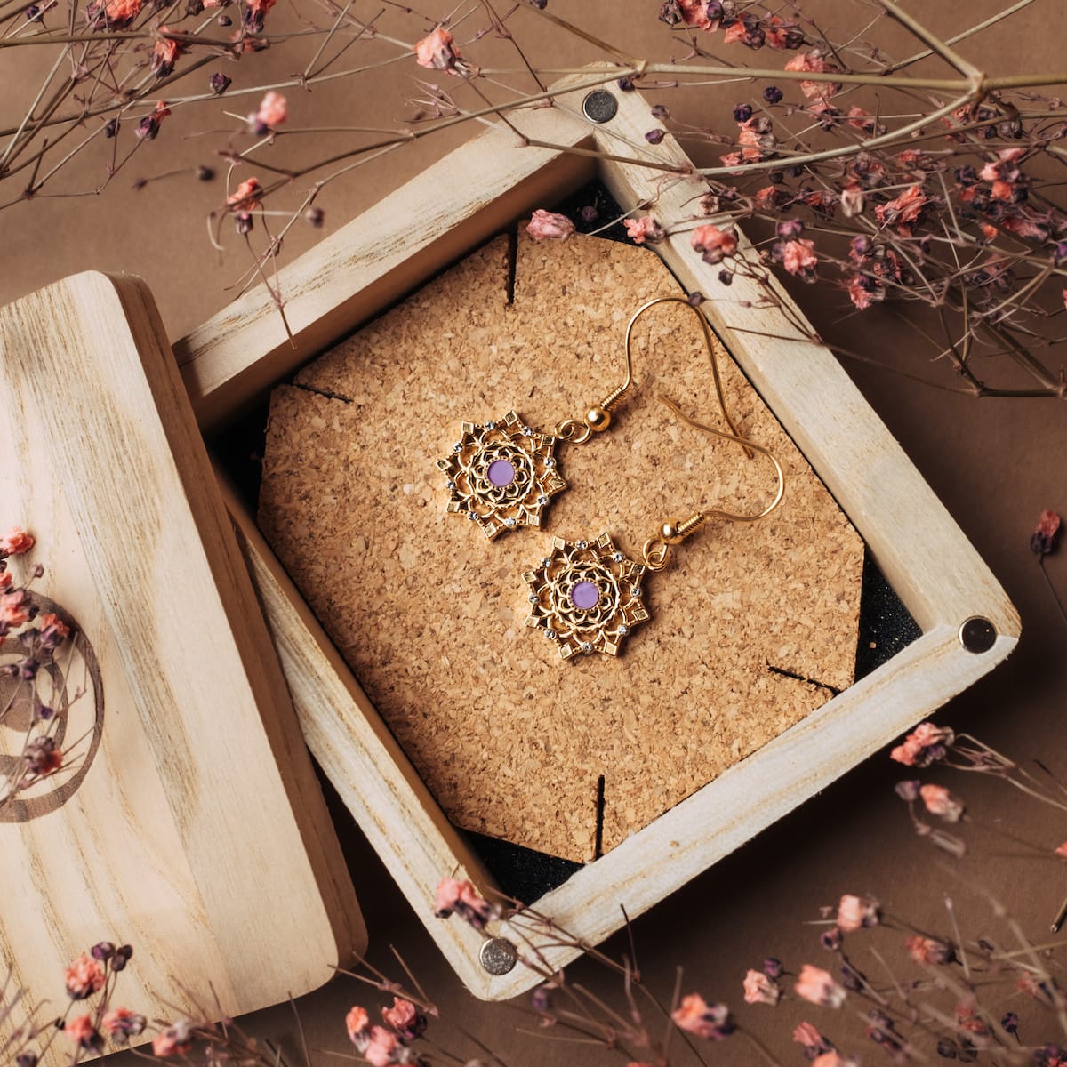 "Aphonia Earrings" - Elegant gold and amethyst earrings with intricate design.