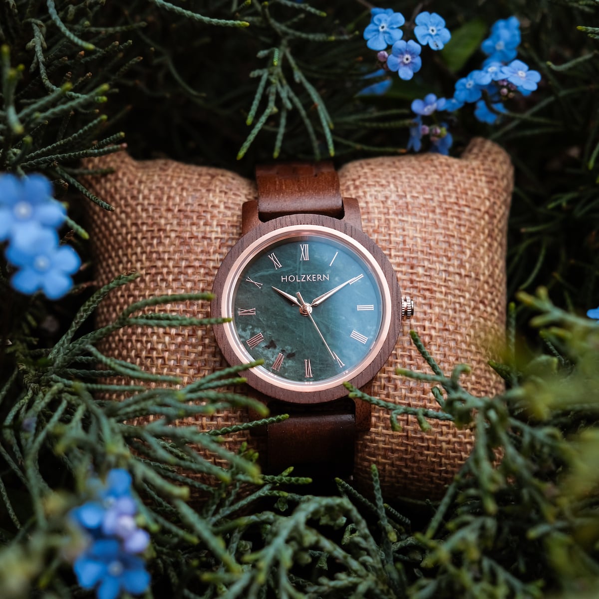 "Nymph" watch with a walnut case and marble dial, featuring a natural, rustic style.