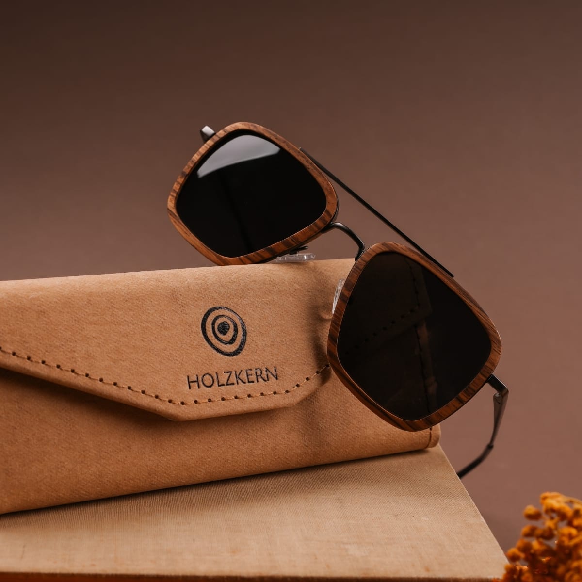 "The Logician" sunglasses in zebrawood and dark grey, showcasing a sleek and stylish design.