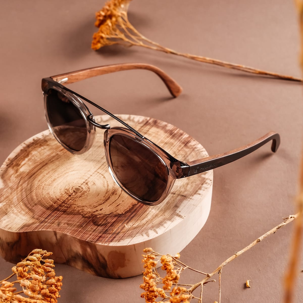 "The Trustworthy" sunglasses feature a sleek wood and ash design, blending natural elegance with modern style.
