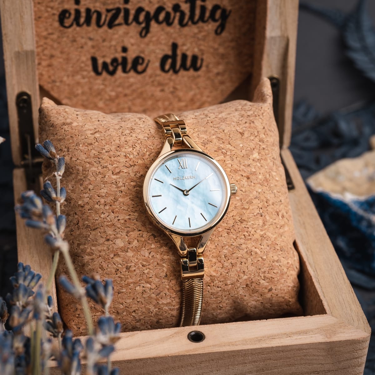 "Shesha" watch, featuring nacre and gold materials with an elegant design.