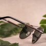 "The Badass II" sunglasses featuring an elegant Leadwood and Antique Silver design, highlighting a sleek and natural style.
