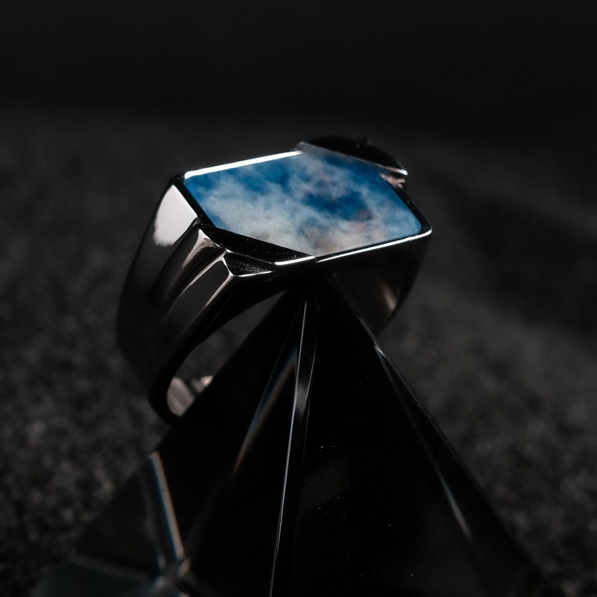 "Binomial Ring", a stylish ring featuring sodalite and silver, with a modern geometric design.