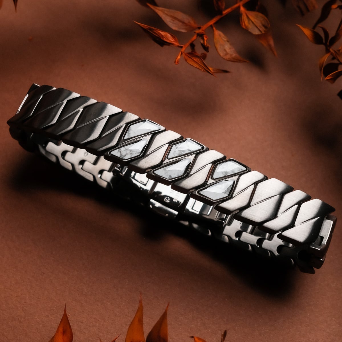 "Baritone" bracelet features an elegant design with howlite accents and a dark gray finish.