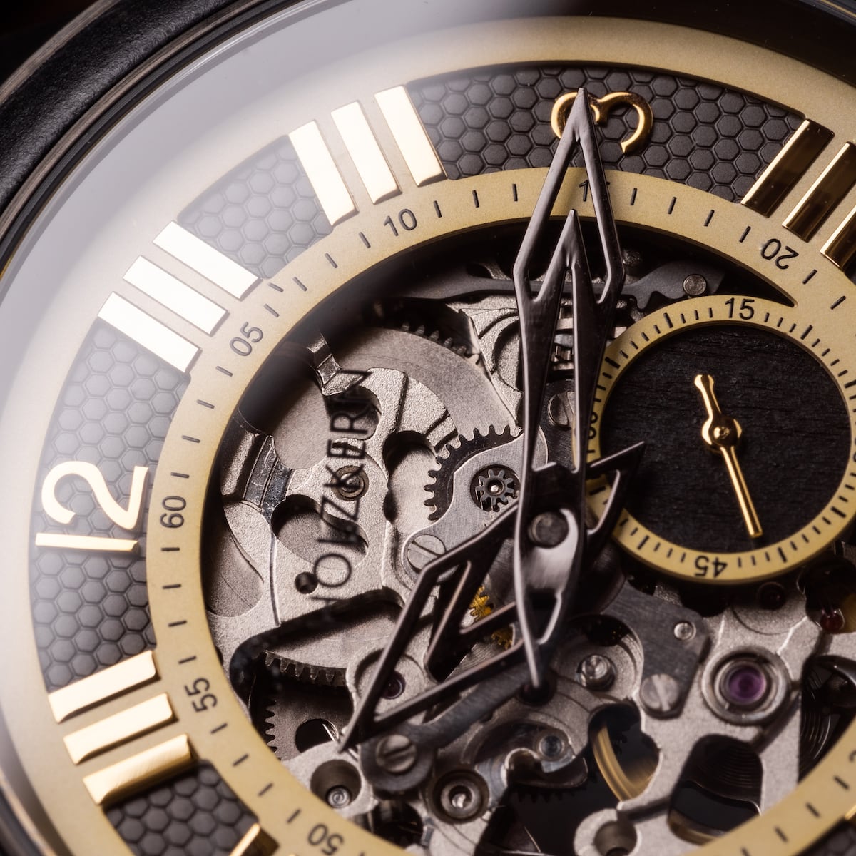 "Navona" watch featuring a detailed, mechanical design with a maple and gold color scheme.