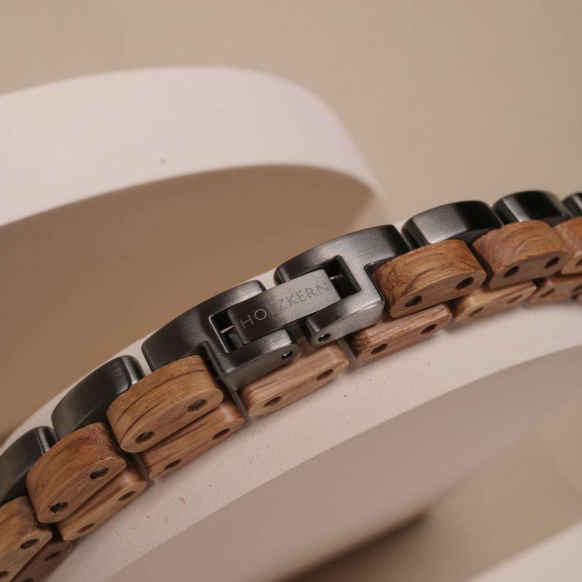 "Duet", a stylish bracelet with oak and gray links, featuring a modern design.