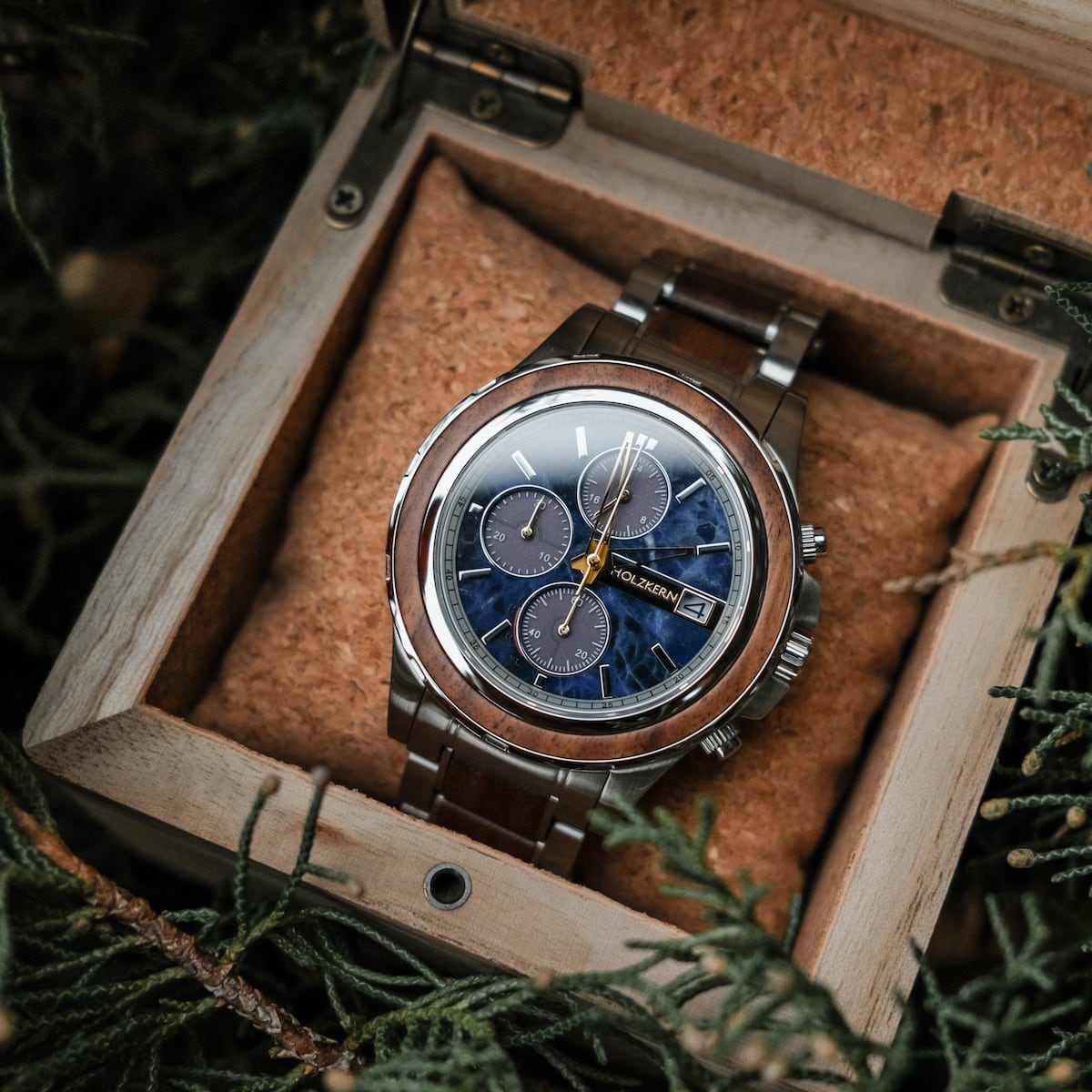 "Koh Mak" watch featuring a sophisticated walnut and marble design, presented in a wooden box.