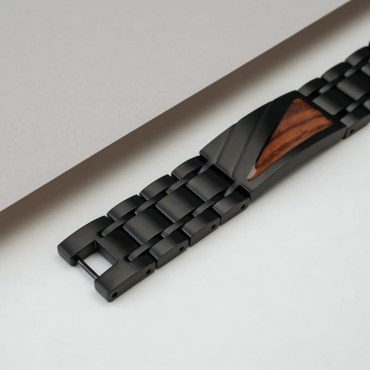 "Looper" wristband, featuring a sleek zebrawood and black design for a modern, stylish look.