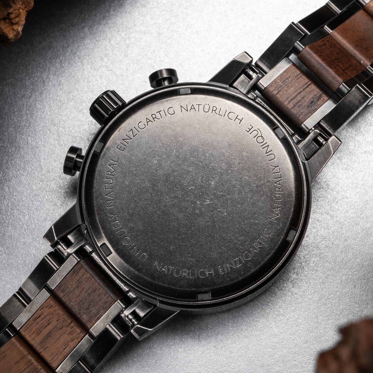 "Syntonize" watch featuring a sophisticated blend of sodalite and walnut with a sleek, modern design.
