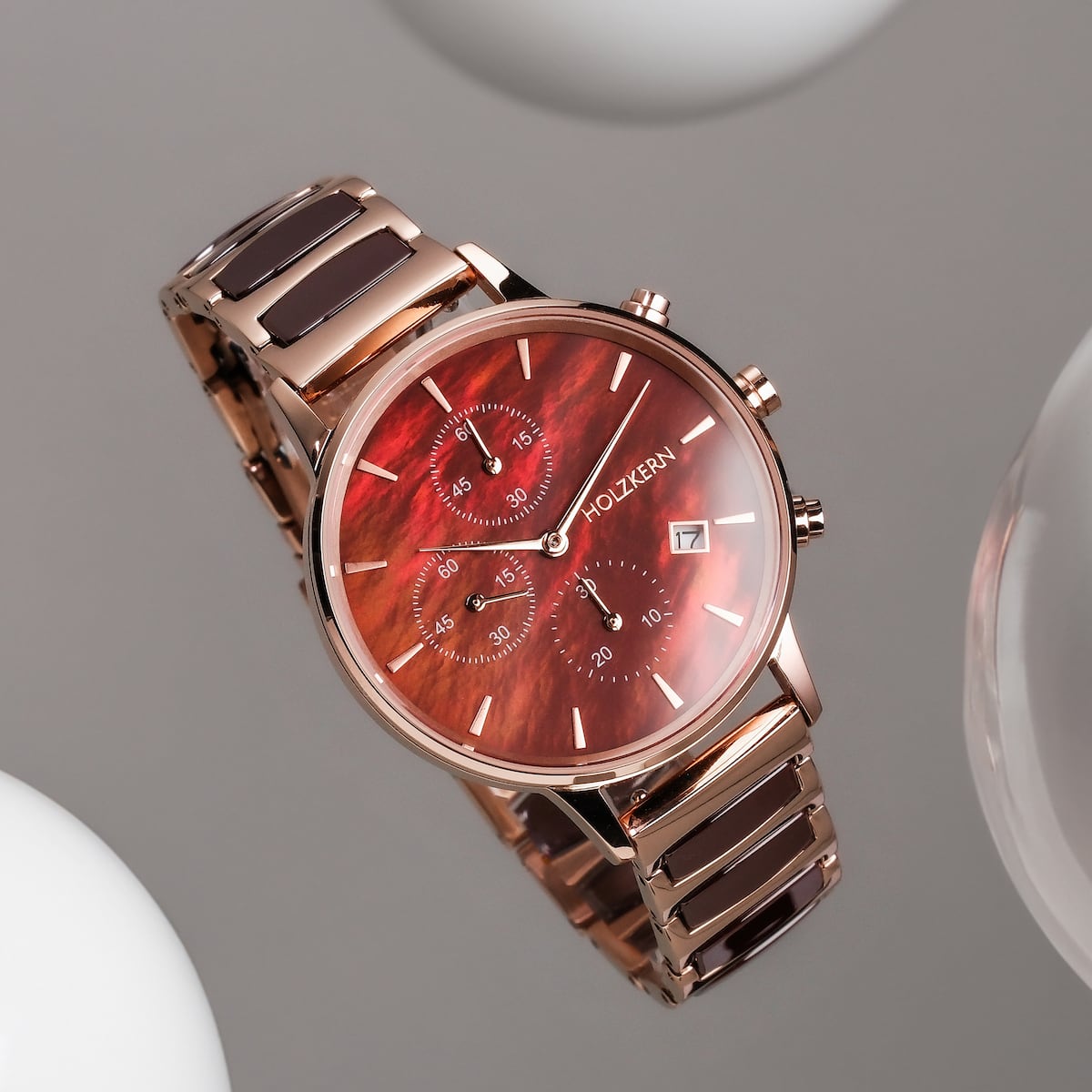 "Cheery" watch featuring a nacre and ceramic design with elegant chronograph detail.