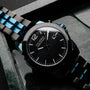 "Glaciersurge" watch featuring a sleek, modern design with a black dial and stainless steel elements.