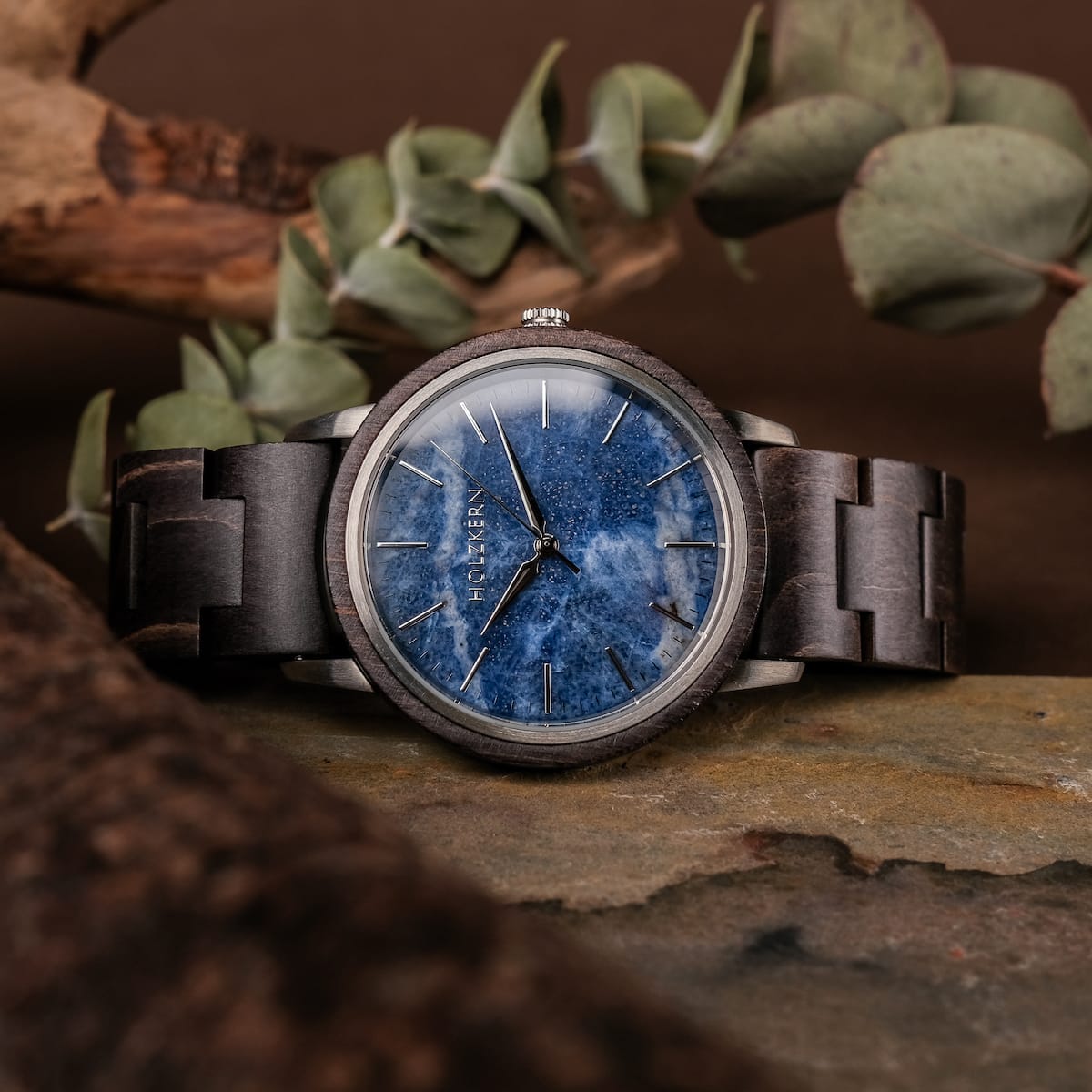 "Immanuel" watch featuring a maple wood band and sodalite dial, styled with a natural, earthy aesthetic.
