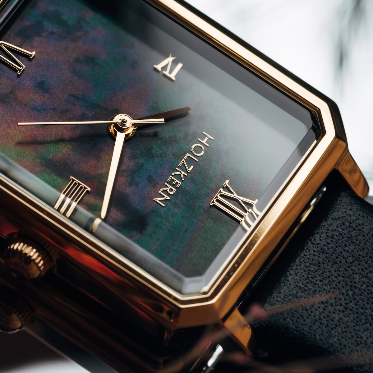 "Auctoritas" watch features a nacre dial and gold accents with a sleek, elegant style.