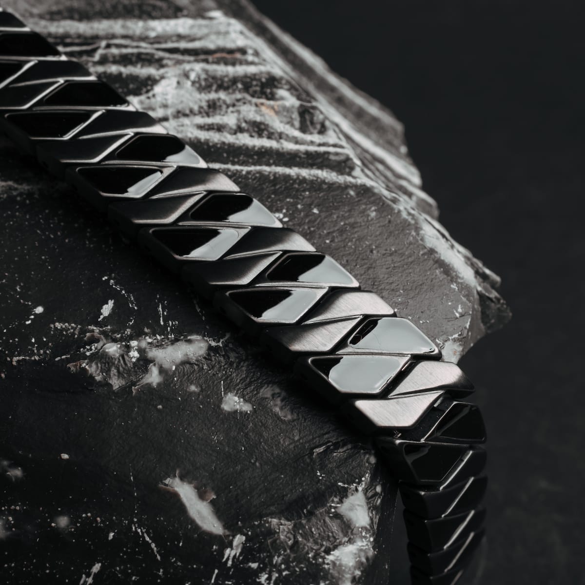 "Baritone" bracelet in maple and dark grey with a sleek, modern design.