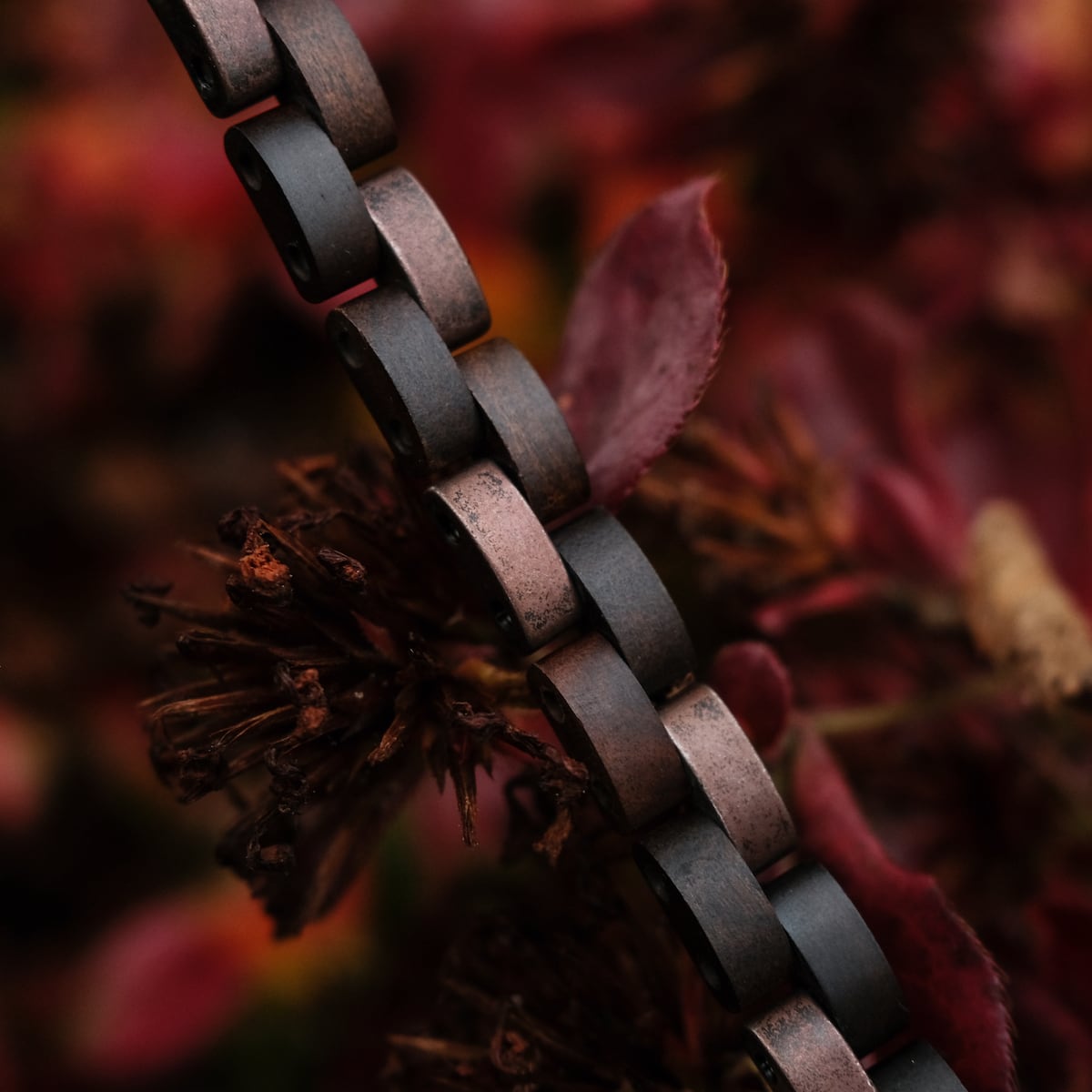 "Rondo" bracelet with a maple and antique copper finish, featuring a warm, rustic aesthetic.