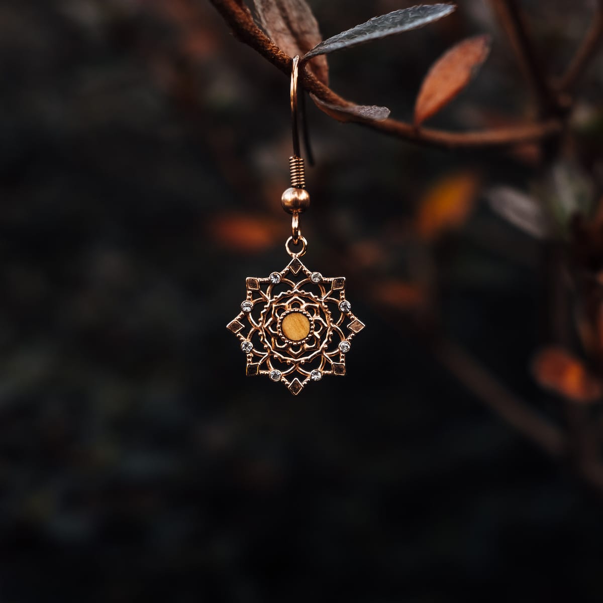 "Aphonia Earrings", elegant earrings featuring a floral olive and rose gold design.