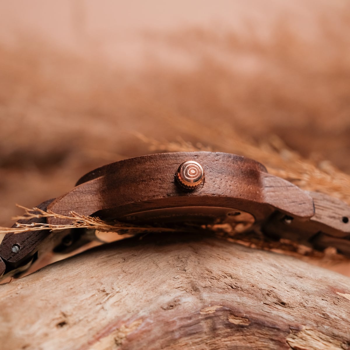 "Nymph", a watch, features a natural walnut and marble design with an organic and rustic aesthetic.