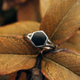 "Facade Ring", marble and silver ring, featuring a hexagonal design and elegant style.