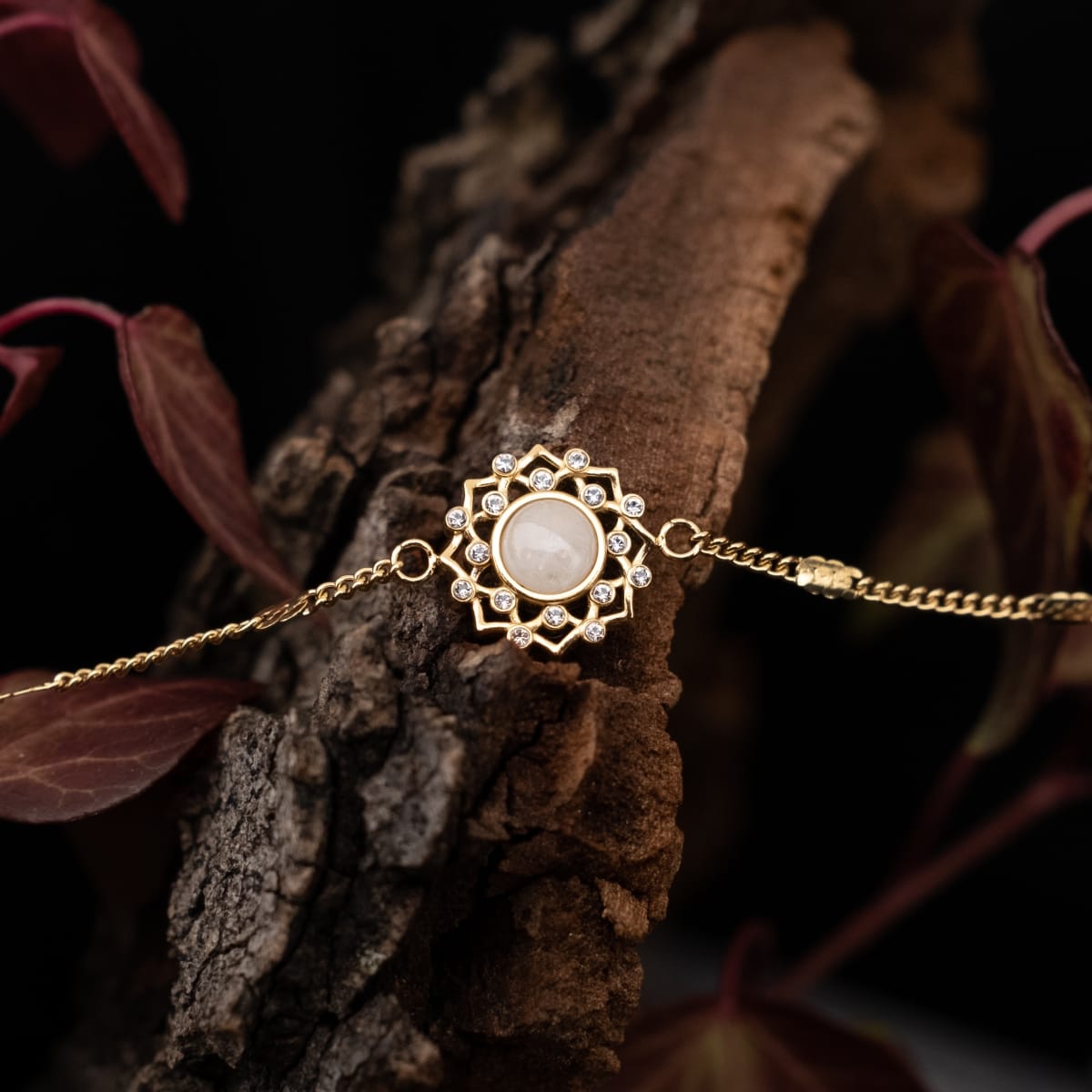 "Composition Gem Bracelet" bracelet featuring moonstone and gold with an elegant, intricate design.