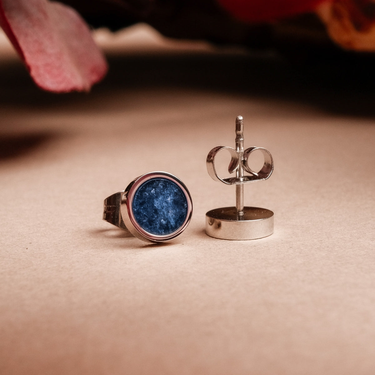 "Pigment Earrings" stud earrings featuring a marble texture and silver finish, elegant and artistic design.